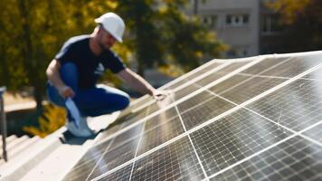 A chief engineer oversees the installation of solar panels on a rooftop. The scene highlights expert supervision and modern renewable energy solutions in action photo