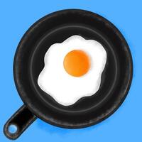 an egg in a frying pan on a blue background photo