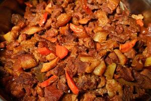 a pot of food with meat and vegetables photo