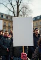 Protester Holding Blank Sign During Demonstration photo