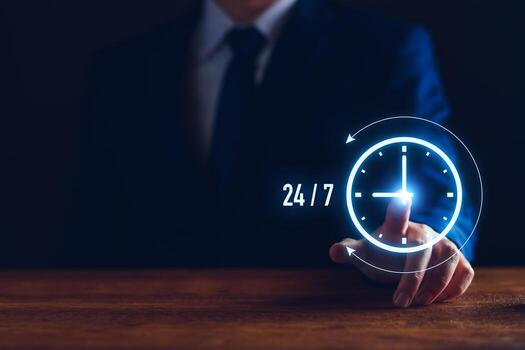 nonstop service concept. businessman show virtual 24-7 with clock for worldwide nonstop and full-time available contact of customer service concept. digital online customer service on internet network photo