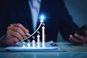 Interest rate and dividend concept. Businessman with percentage symbol and up arrow, Interest rates continue to increase, return on stocks and mutual funds, long term investment for retirement. photo