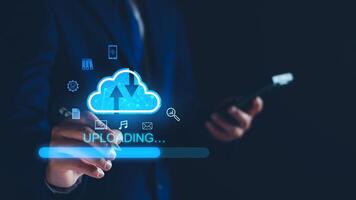 Data upload to cloud storage computing concept. Man using smartphone and computer to upload and download business information, media files. Cloud computing technology, intelligent storage on Internet. photo