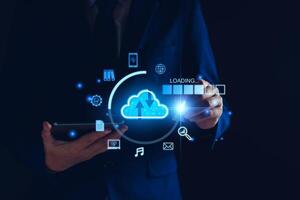 Data download from cloud computing concept. Man using smartphone and computer to download, upload business information, media files. Cloud computing technology, intelligent storage on Internet photo