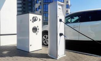 Service of stations for pumping tires of vehicles and dispensing water. Automatic pump at the gas station to check the pressure level. Inflating tires from the outside, self-service air compressor photo