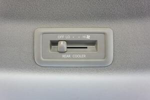 Car AC switches in the second row of the car. Air conditioner vent in the car ceiling. Vehicle AC controller photo