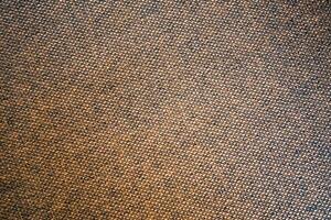 Close-Up Texture of Brown Fabric with Detailed Weave Pattern for Background or Design Elements photo