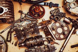 Assorted Mechanical Parts and Gears on a Workbench - Industrial Engineering and Machinery Components photo