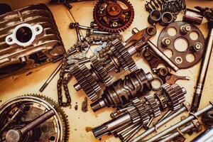 Assorted Mechanical Parts and Gears on a Workbench - Industrial and Engineering Components photo