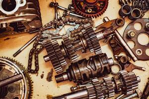 Close-Up of Mechanical Gears and Parts in a Workshop Setting with Vintage Tones photo