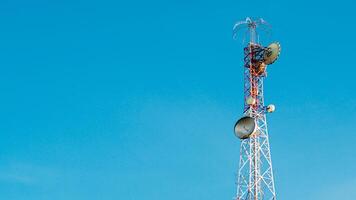 Tall Communication Tower Against Clear Blue Sky on a Sunny Day photo