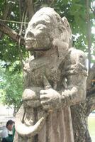 Indonesian stone statues exposed to hot sunlight photo