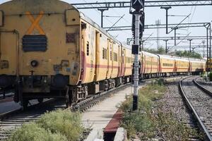 Delhi, India, June 09 2024 - Indian railway express train at departure from Anand Vihar railway station during morning time, Colourful Express train at Delhi railway station photo