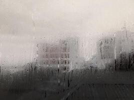 misted glass with droplets of water draining down photo