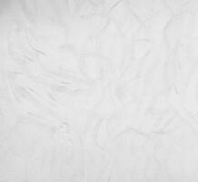 White cement wall curved with wave pattern. Modern design of white wavy background photo