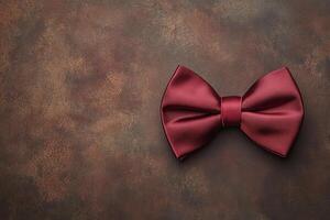 Elegant silk bow tie on a textured background photo