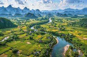 A breathtaking aerial view of a winding river through a verdant, mountainous landscape photo