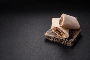Delicious traditional shawarma or doner kebab with beef, mushrooms photo