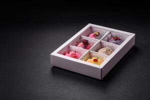 Delicious cold Japanese mochi dessert with colorful rice dough shell and fruit filling photo