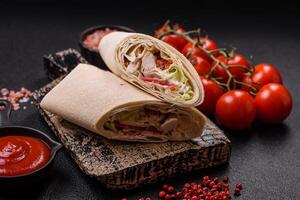 Delicious traditional shawarma or doner kebab with chicken photo