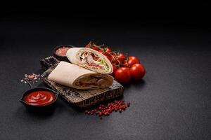 Delicious traditional shawarma or doner kebab with chicken photo