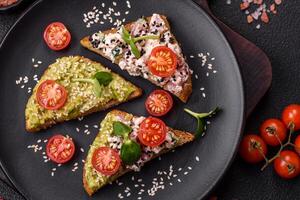 Crispy sandwich or bruschetta with guacamole, tuna and flax seeds photo