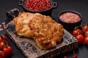 Delicious fried pork or chicken chops breaded with salt and spices photo