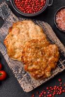 Delicious fried pork or chicken chops breaded with salt and spices photo
