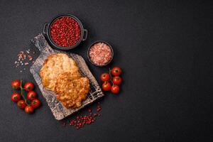 Delicious fried pork or chicken chops breaded with salt and spices photo