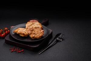 Delicious fried pork or chicken chops breaded with salt and spices photo