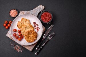 Delicious fried pork or chicken chops breaded with salt and spices photo