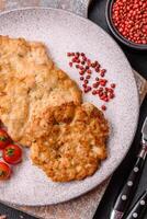 Delicious fried pork or chicken chops breaded with salt and spices photo
