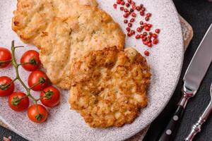 Delicious fried pork or chicken chops breaded with salt and spices photo