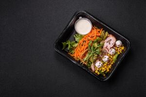 Fresh juicy salad with meat, mozzarella, carrots, lettuce, corn photo