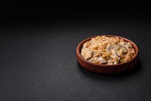Delicious boiled beef or pork tongue sliced with carrots, onions, sour cream photo