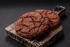 Delicious crispy round oatmeal cookies with chocolate photo
