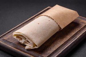 Delicious traditional shawarma or doner kebab with chicken photo