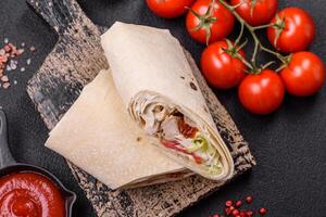 Delicious traditional shawarma or doner kebab with chicken photo