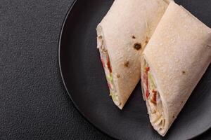 Delicious traditional shawarma or doner kebab with chicken photo