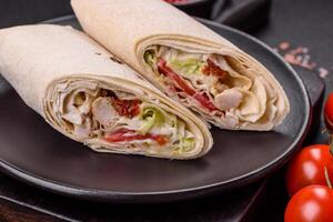 Delicious traditional shawarma or doner kebab with chicken photo