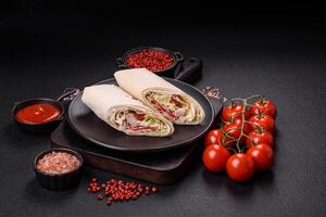 Delicious traditional shawarma or doner kebab with chicken photo