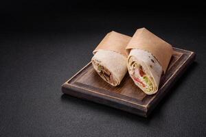 Delicious traditional shawarma or doner kebab with beef, mushrooms photo