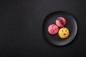 Delicious cold Japanese mochi dessert with colorful rice dough shell and fruit filling photo