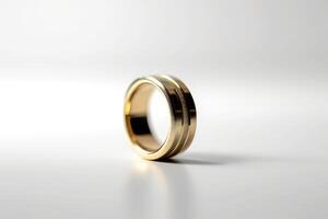 A gold wedding ring on a white background photo