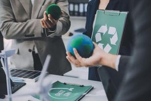 Carbon offset price report CO2 emission. Future growth Net zero waste in ESG ethical SME office protect climate change global warming social issues project. Group of asia people Eco friendly SDGs plan photo
