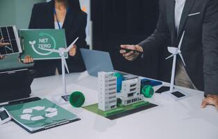Carbon offset price report CO2 emission. Future growth Net zero waste in ESG ethical SME office protect climate change global warming social issues project. Group of asia people Eco friendly SDGs plan photo