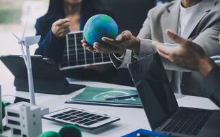 Carbon offset price report CO2 emission. Future growth Net zero waste in ESG ethical SME office protect climate change global warming social issues project. Group of asia people Eco friendly SDGs plan photo