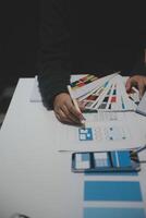 Professional interior designer at workplace in office, closeup photo