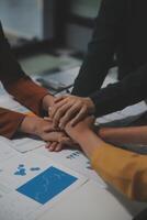Hand join together for work togetherness, Hand stack for business and service, Team volunteering or teamwork. Concept connection of community and charity. Group of business workforce participation. photo
