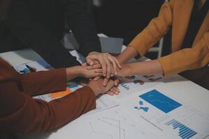 Hand join together for work togetherness, Hand stack for business and service, Team volunteering or teamwork. Concept connection of community and charity. Group of business workforce participation. photo